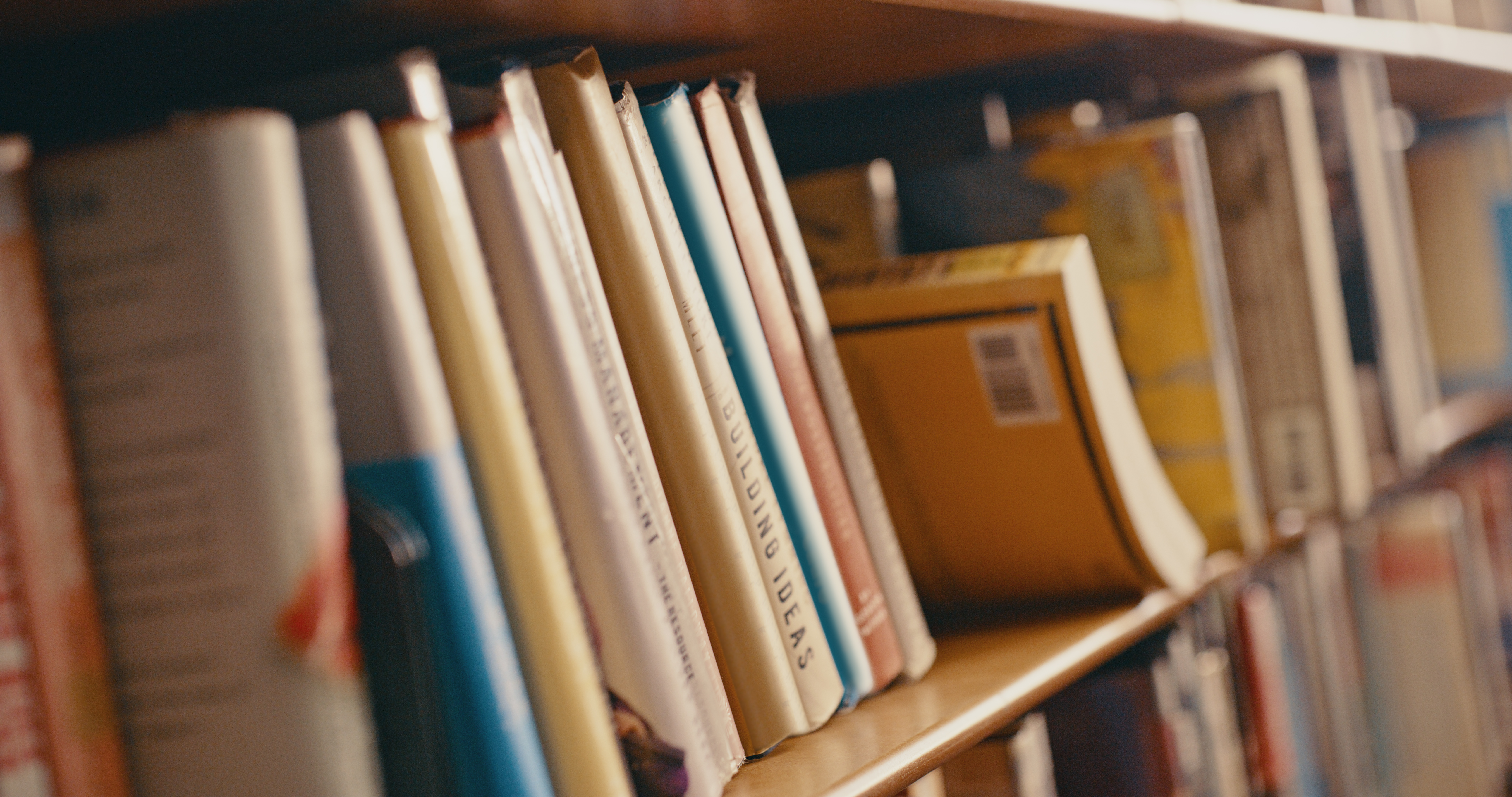 Deep shelves of a library — the depth of knowledge that builds topical authority
